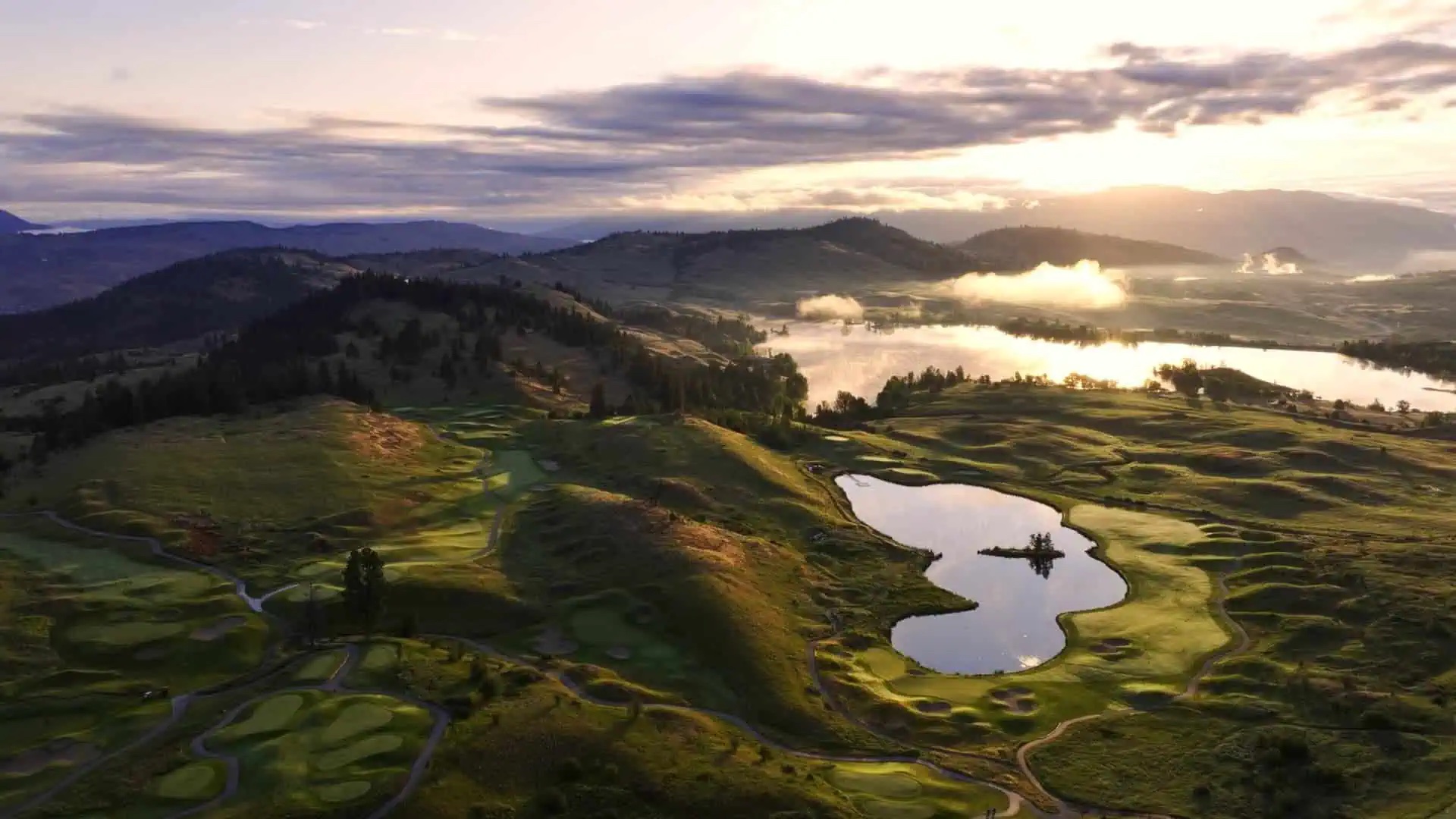 Okanagan Valley with lake and vineyards at golden hour
